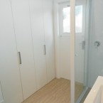 bathroom with enclosed laundry at blacktown granny flat